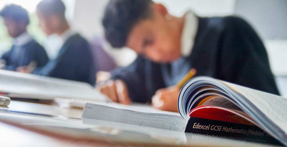 Student, writing in class 